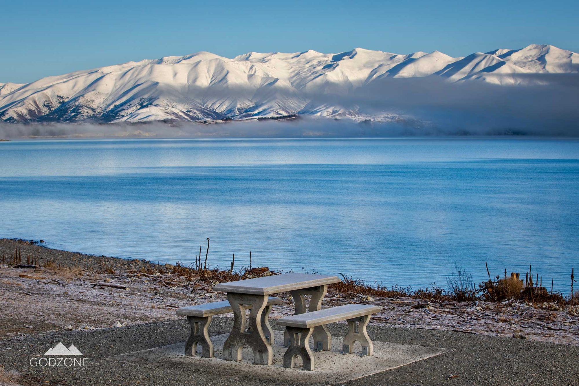 Beautiful aqua photograph of Lake Pukaki on the road to Mount Cook/Aoraki. Stunning blue and white landscape photograph NZ.