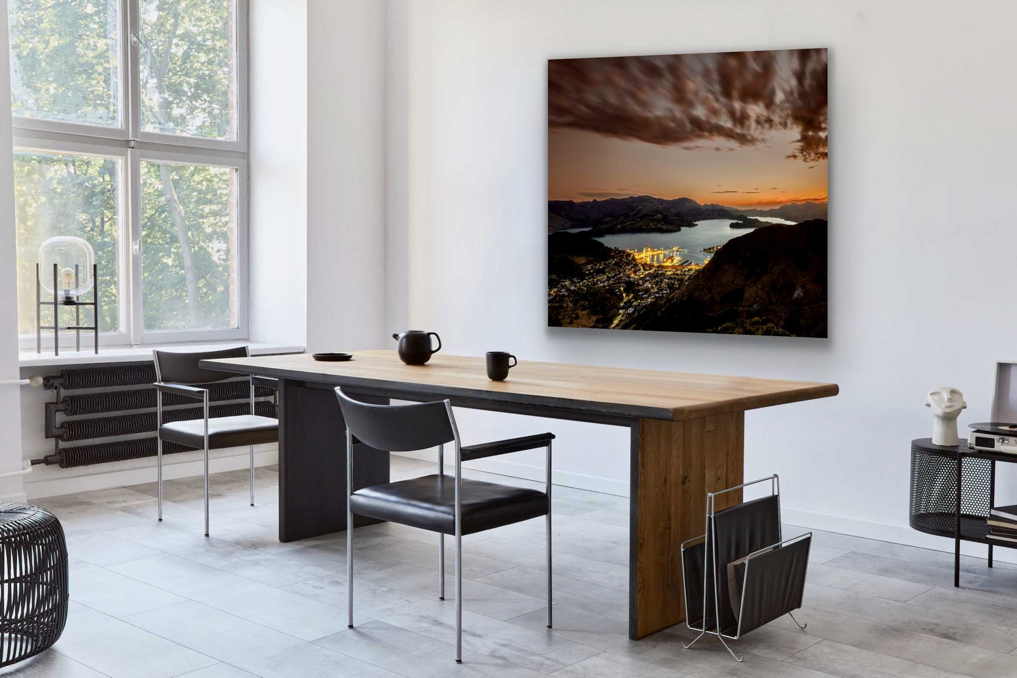 Aerial photograph of Lyttelton harbour in Christchurch on the wall. In situ artwork, hung behind a dining table.