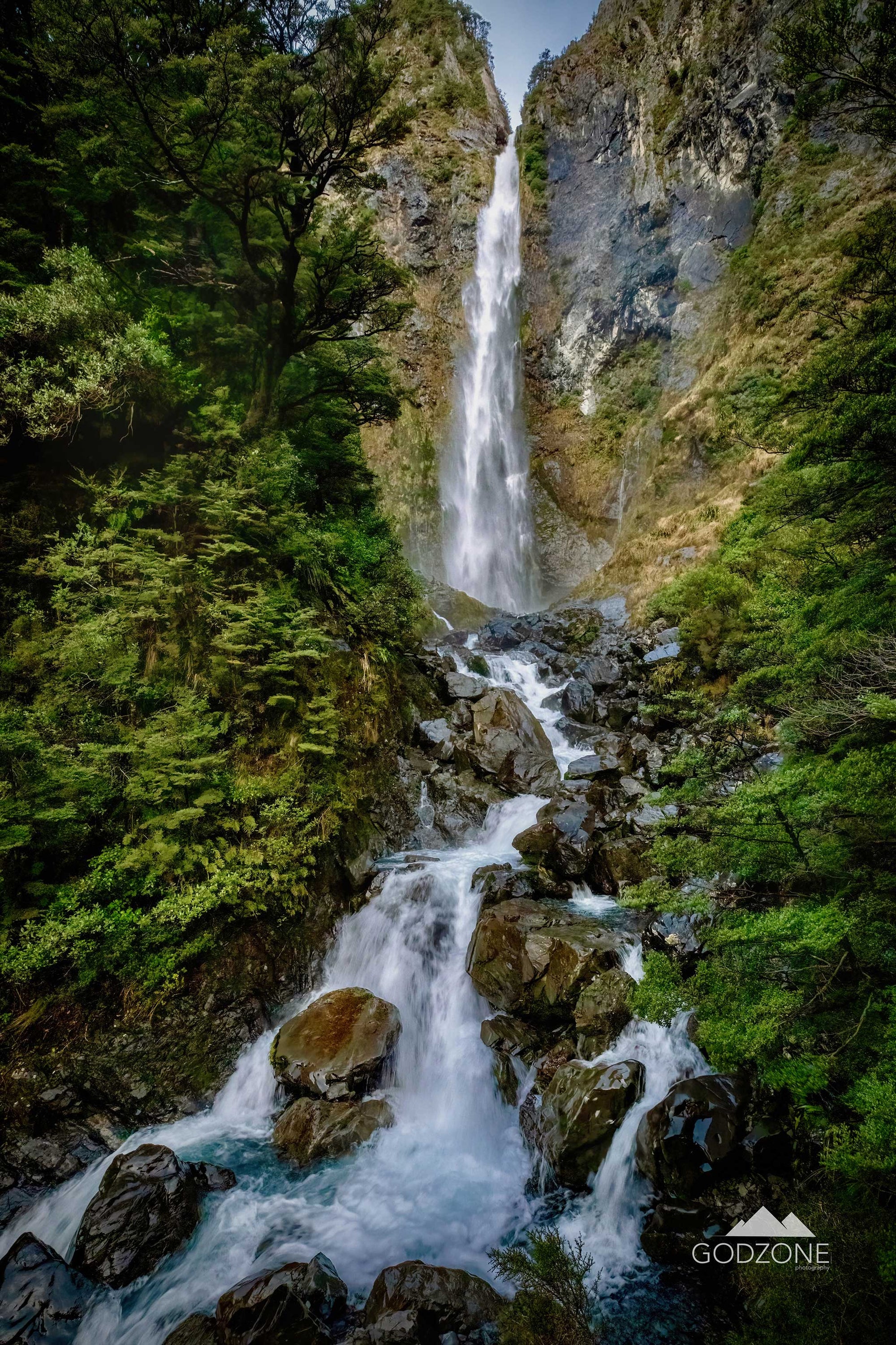 Photographic print of a waterfall in the Devils Punchball, Arthurs Pass Village. South Island landscape photography New Zealand.