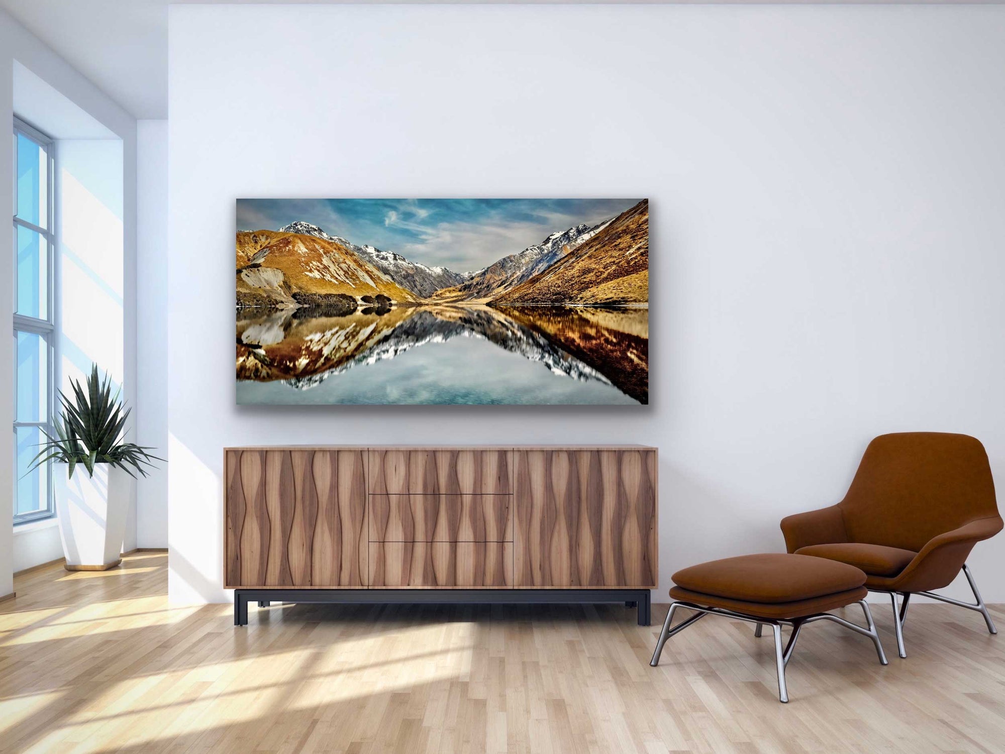 Lake Tennyson photograph hung in situ above cabinet on white wall. NZ interior design mustard and aqua coloured artwork.