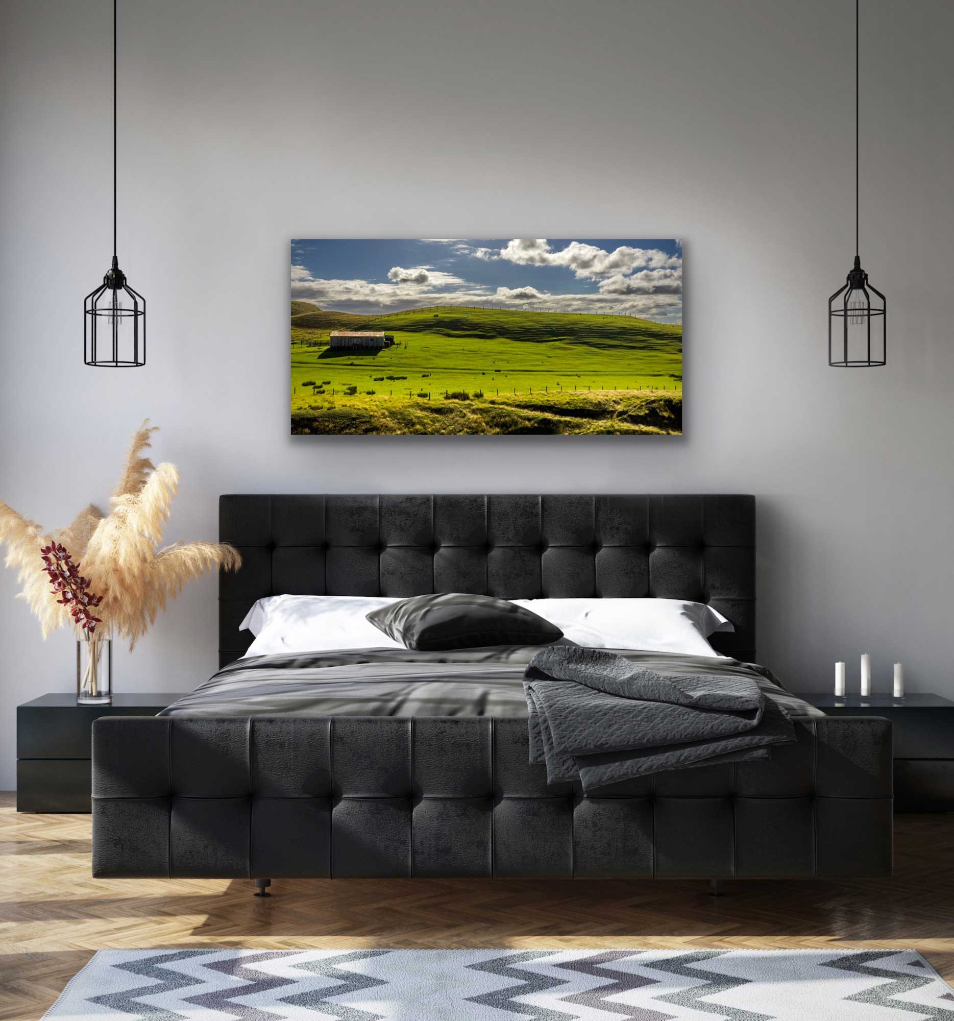 Farmland Marlborough landscape photograph in situ, hung above a bed. New Zealand countryside interior design art.